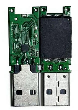 Semi-finished USB flash board shown from both sides, with PCB traces on one side and the memory chip on the other